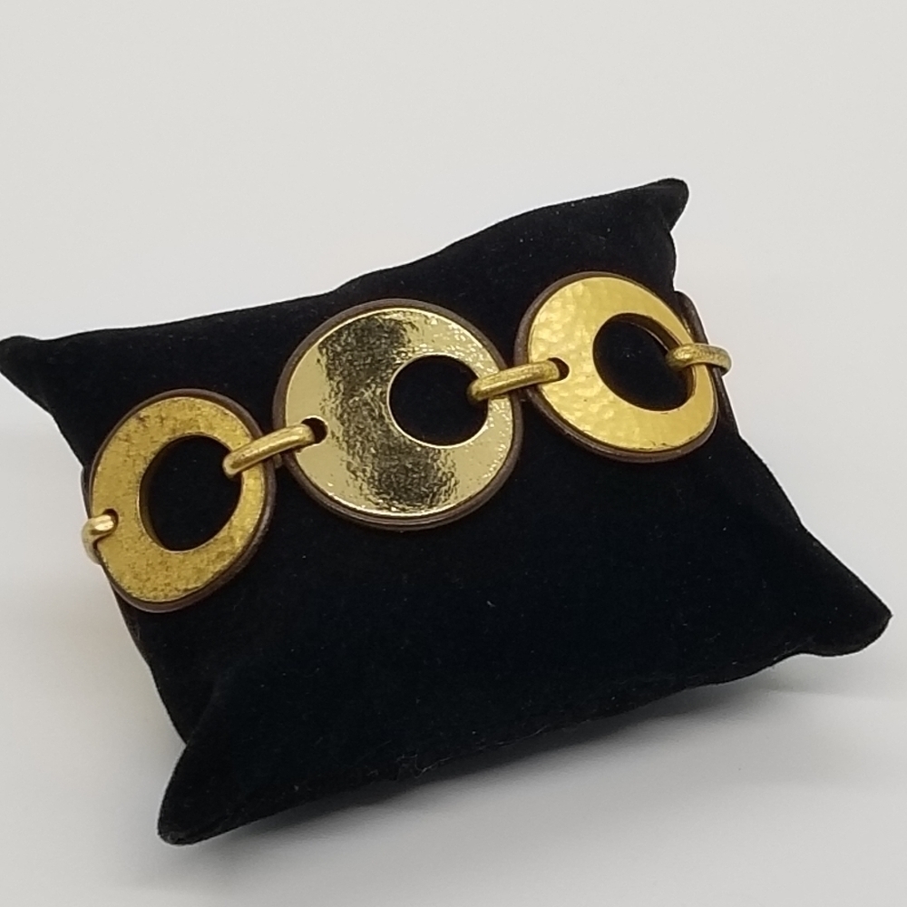 Chico's gold tone cutout disk bracelet with brown trim